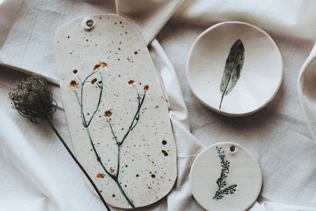 Flat lay of handcrafted ceramic products on a linen background