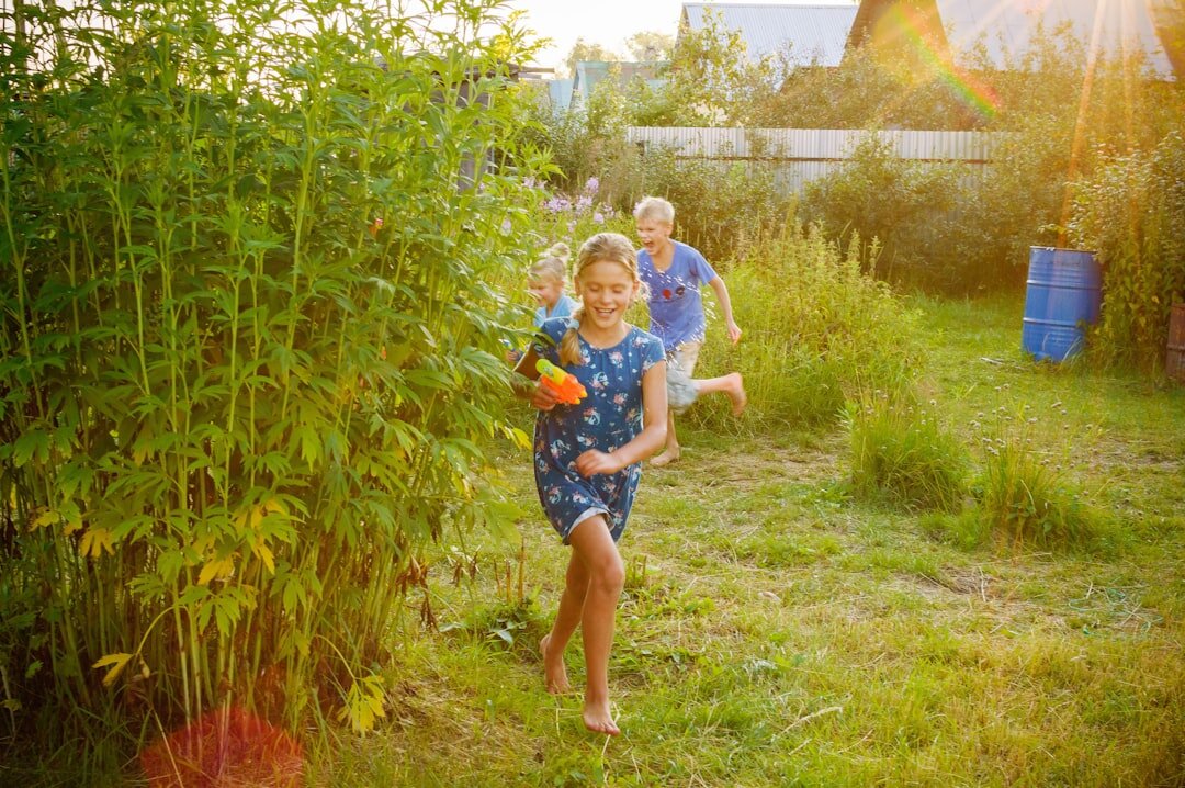 Danish family with two children playing together in a garden
