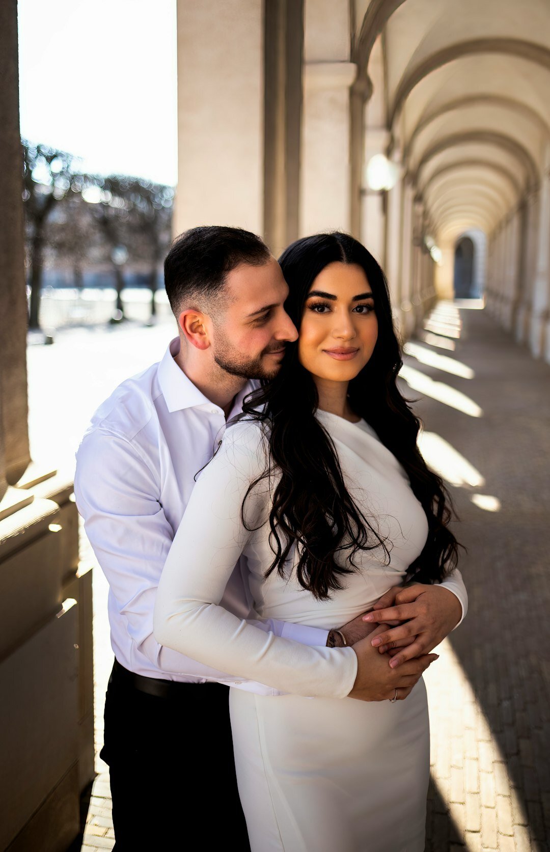 Danish bride and groom embracing outdoors during golden hour