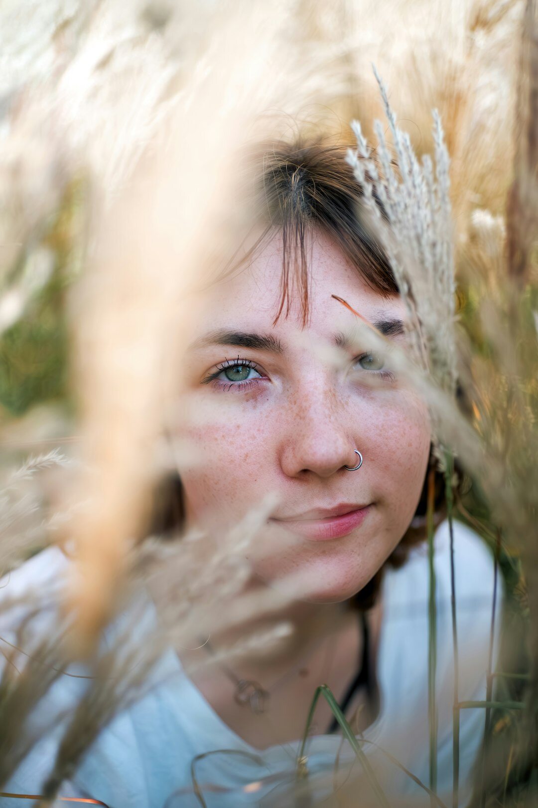 Headshot of a Danish female photographer smiling softly
