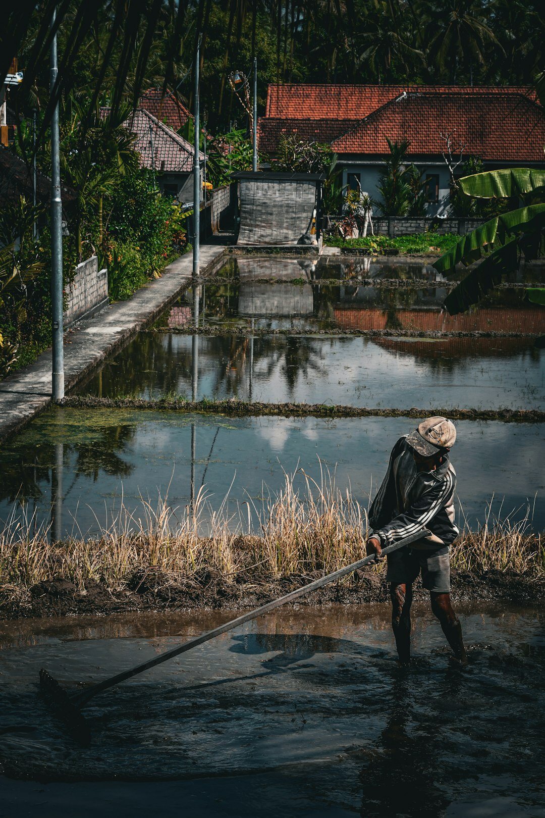 photographer with camera in village